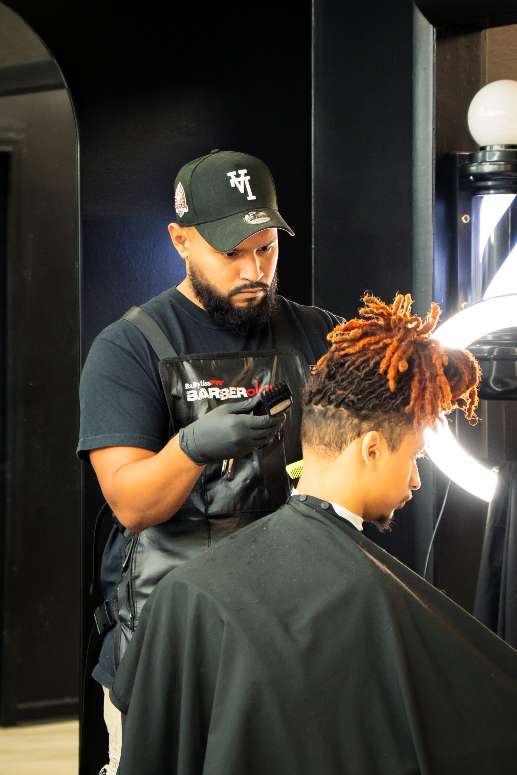 Isaac Fuentes, senior barber at Golden Barbershop.