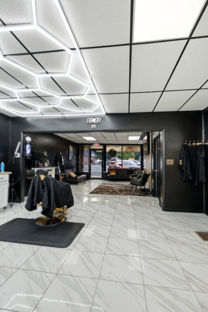 Marble floor and entryway looking toward the front of Golden Barbershop.