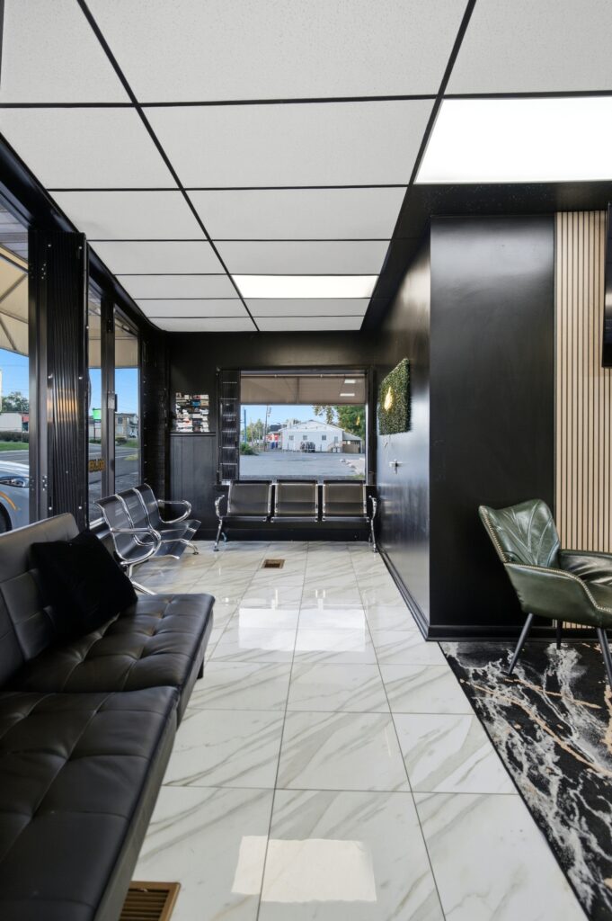 Entrance and seating area at Golden Barbershop on Winchester Avenue.